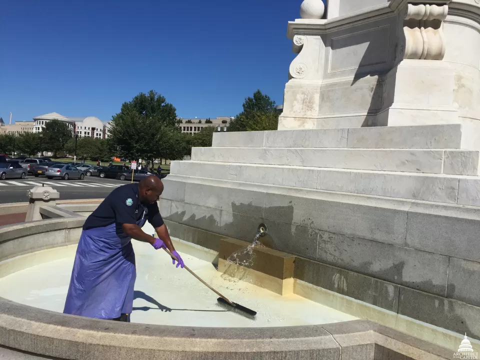 Cleaning the fountain at Peace Memorial.