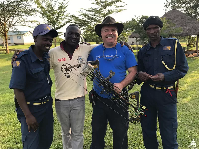 Bill Burns poses with some of the guards that work for KenyaRelief