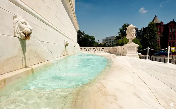 Lion heads serve as spouts for water in this fountain at the Supreme Court Building.