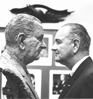 President Johnson examines his bust's likeness "nose to nose."