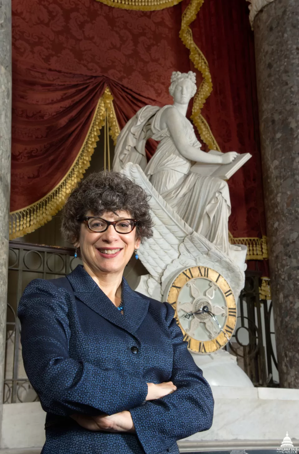 Cohen in front of her favorite piece of art on the Capitol campus, The Car of History Clock, designed by Benjamin Latrobe and carved by Carlo Franzoni.