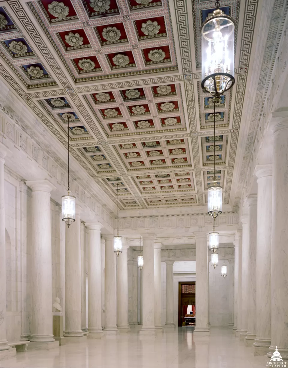 The main corridor, known as the Great Hall, has double rows of monolithic marble columns which rise to a coffered ceiling.