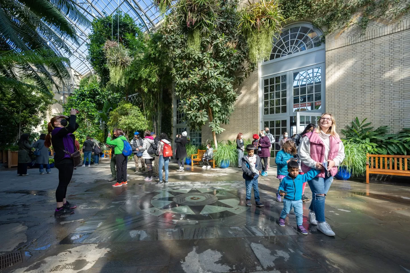 Some of the first visitors back in the USBG Conservatory after it reopened.
