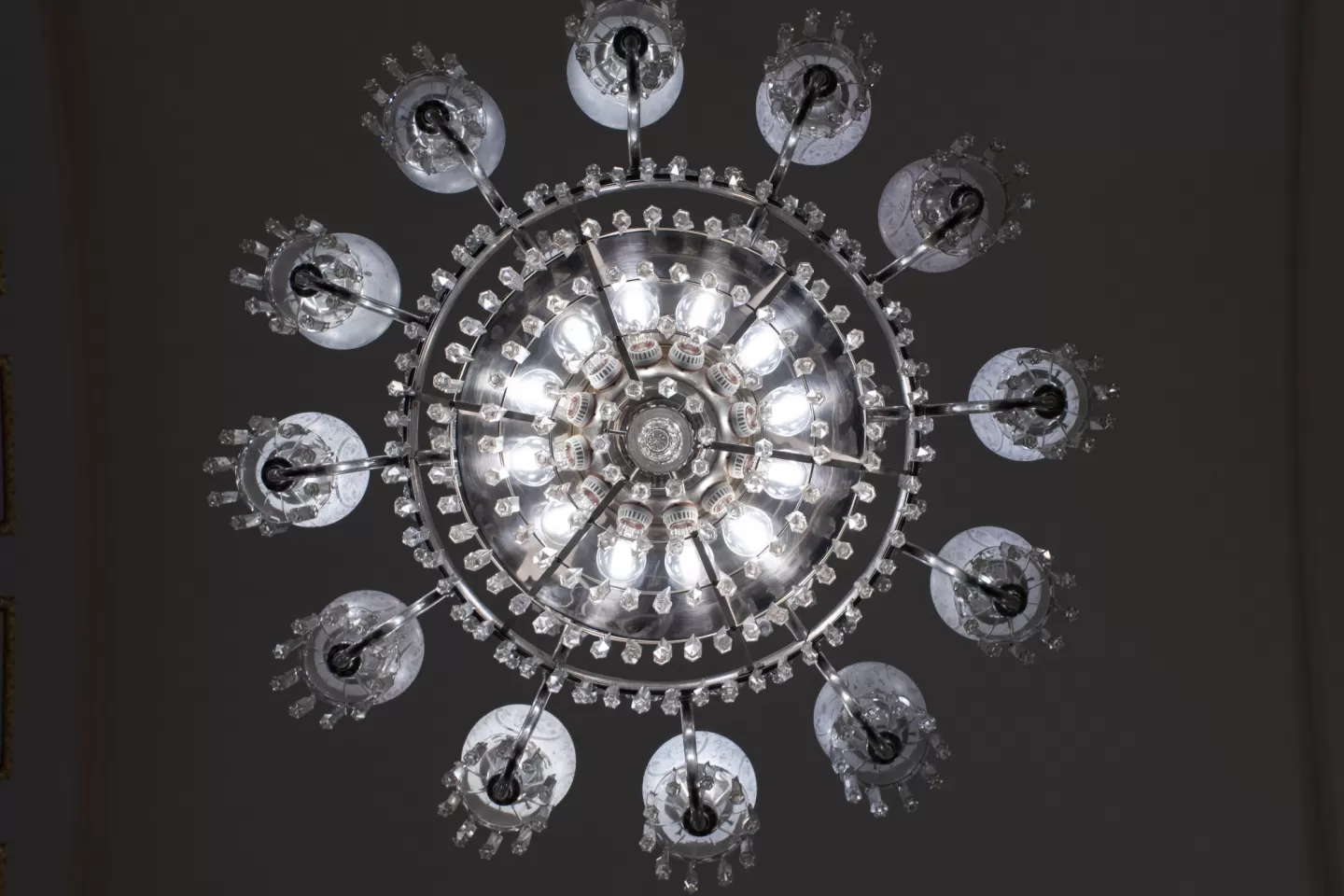 The Caucus Room chandelier, a prominent feature of the space, can be seen in original photos dating to 1908.