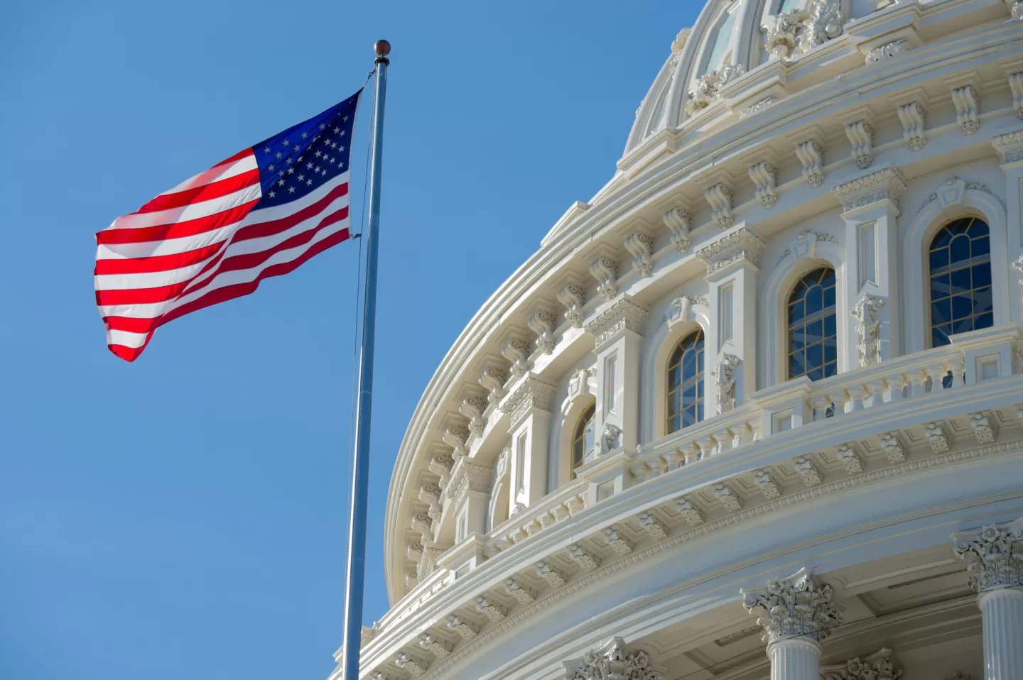 Flag of the United States of America near the U.S. Capitol Dome.