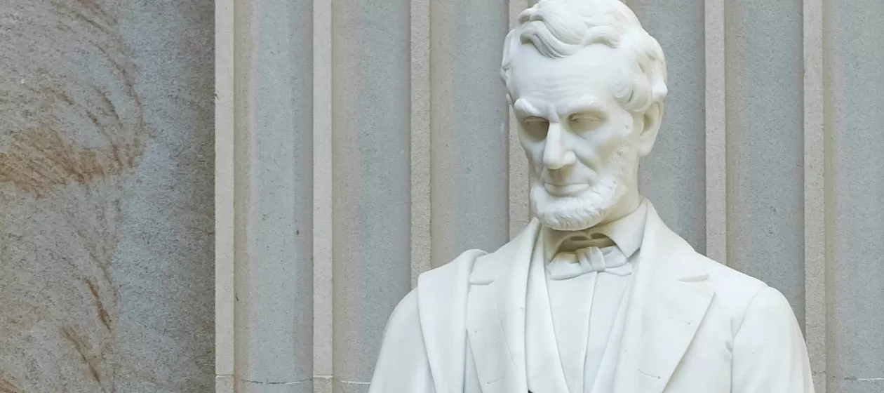 Close-up detail of Abraham Lincoln's statue in the U.S. Capitol Rotunda.