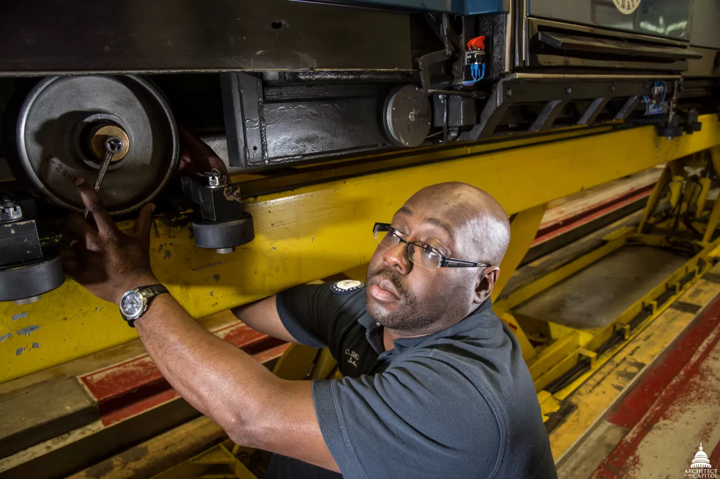 Person working on machinery.