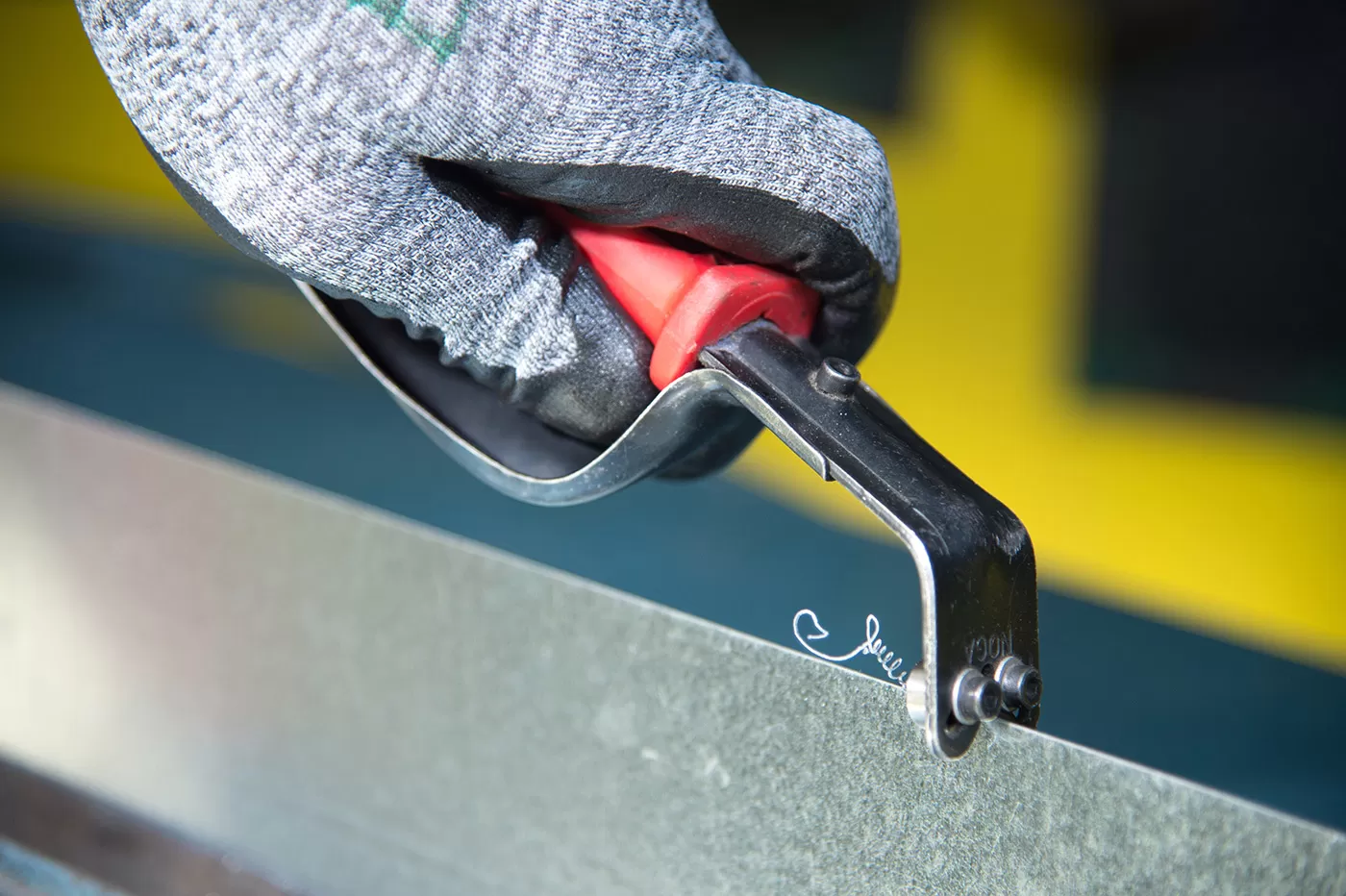 The deburring tool used to remove sharp edges from sheet metal.
