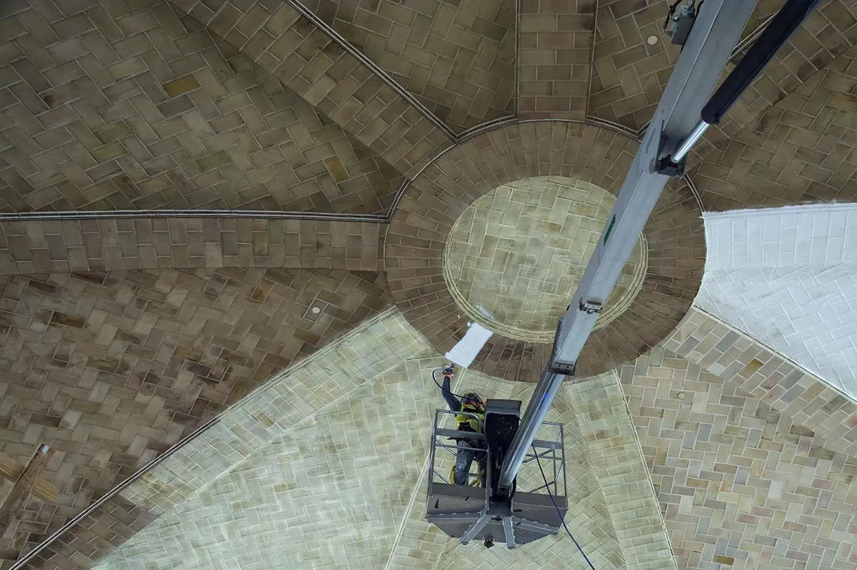 Person working on a ceiling.