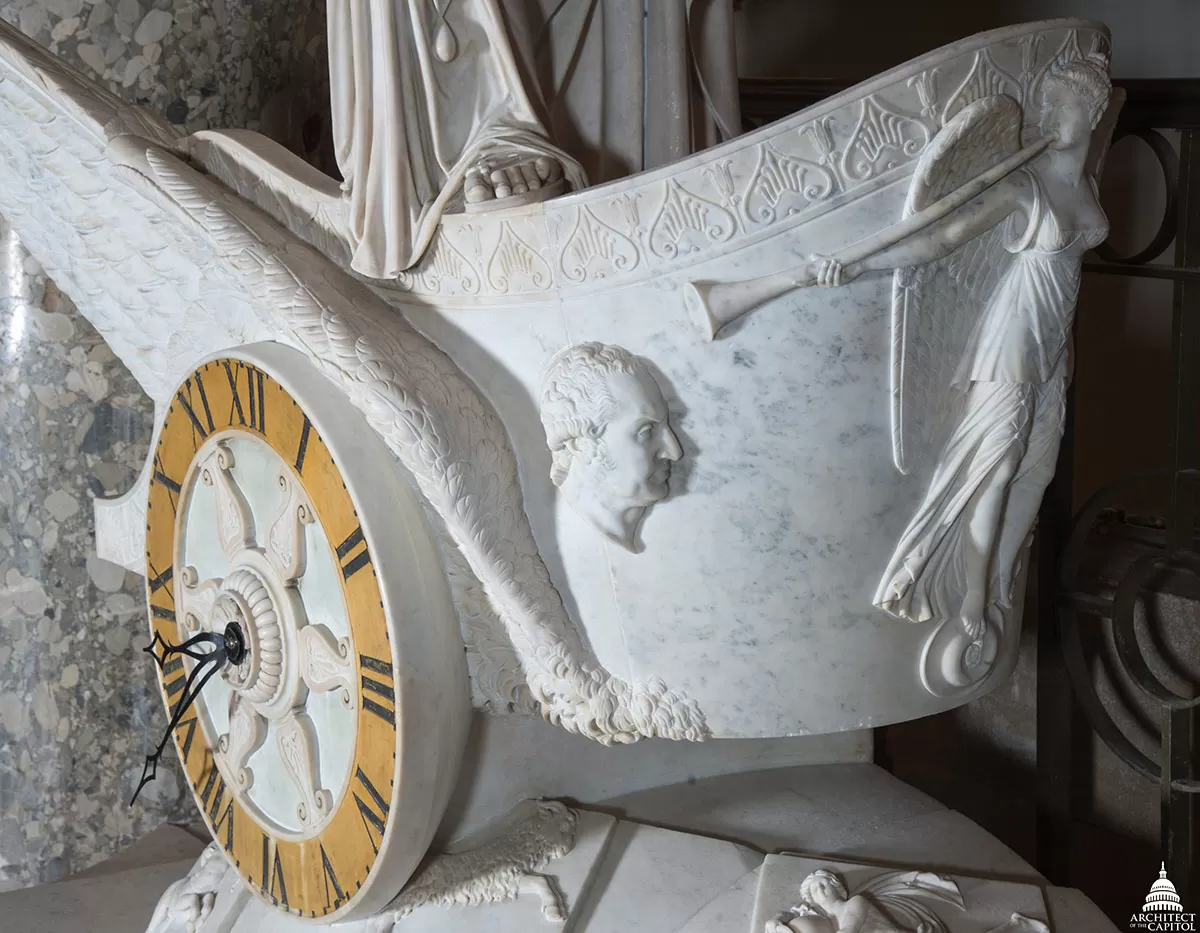 A small bust of George Washington carved into the Car of History marble chariot.