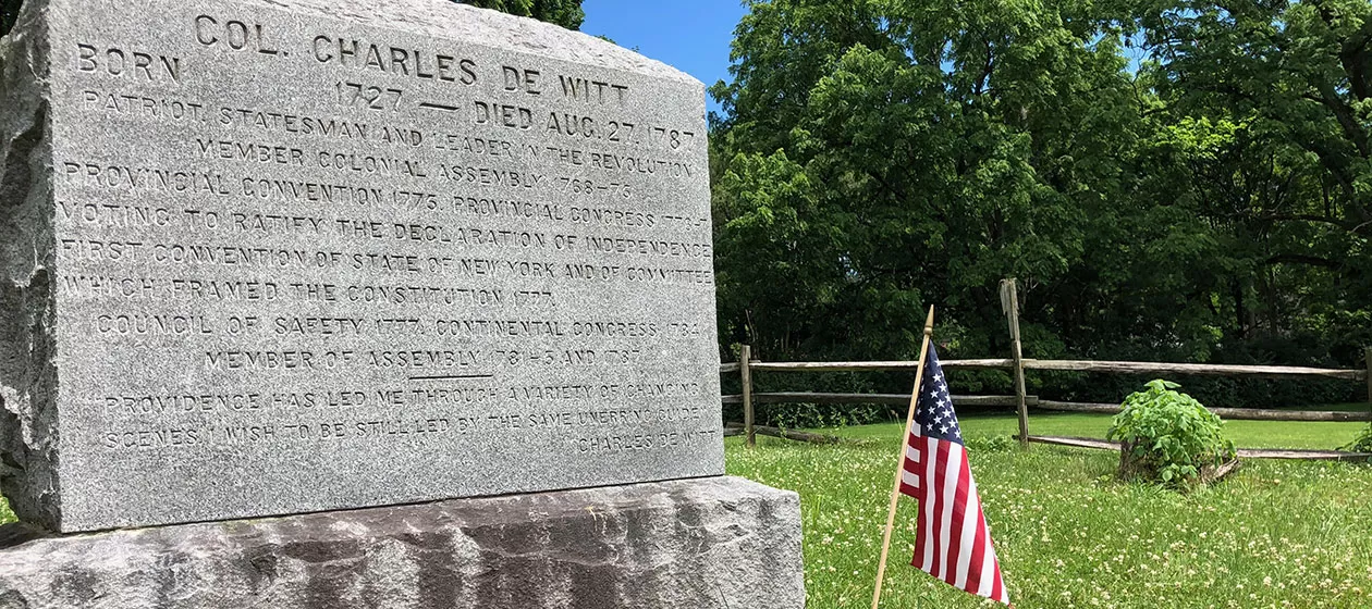 The tombstone of Colonel Charles De Witt. Born 1727 - Died Aug. 27, 1787. Patriot, statesman and leader in the revolution. Voting to ratify the Declaration of Independence.