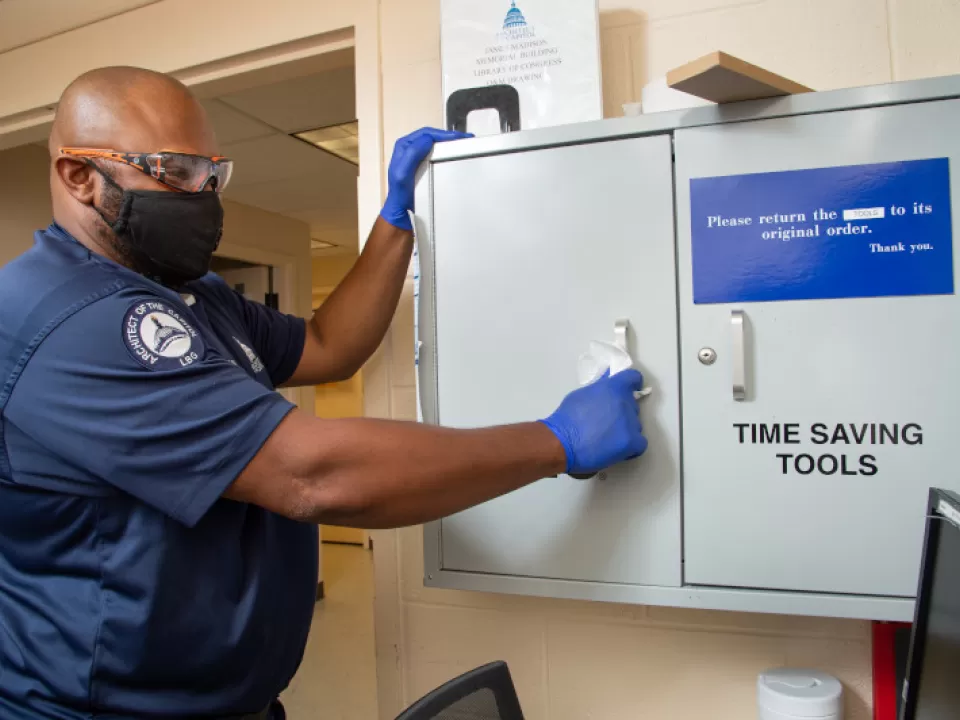 Robert Hollins cleans high-touch surface areas and work spaces in the Library of Congress buildings.