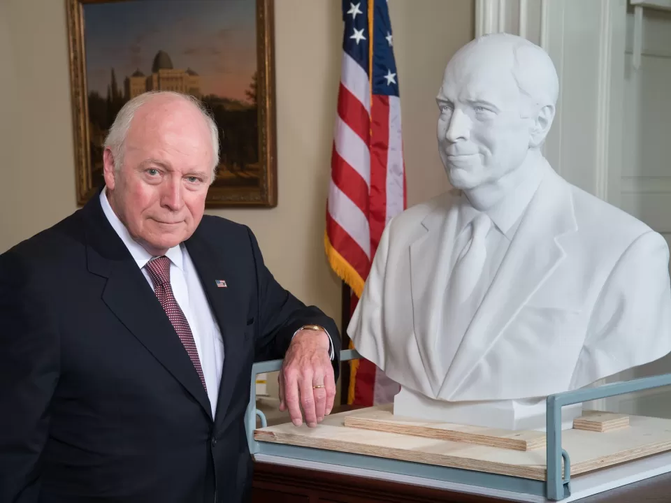 Vice President Cheney poses with the bust created in his honor for the Senate collection in the U.S. Capitol.