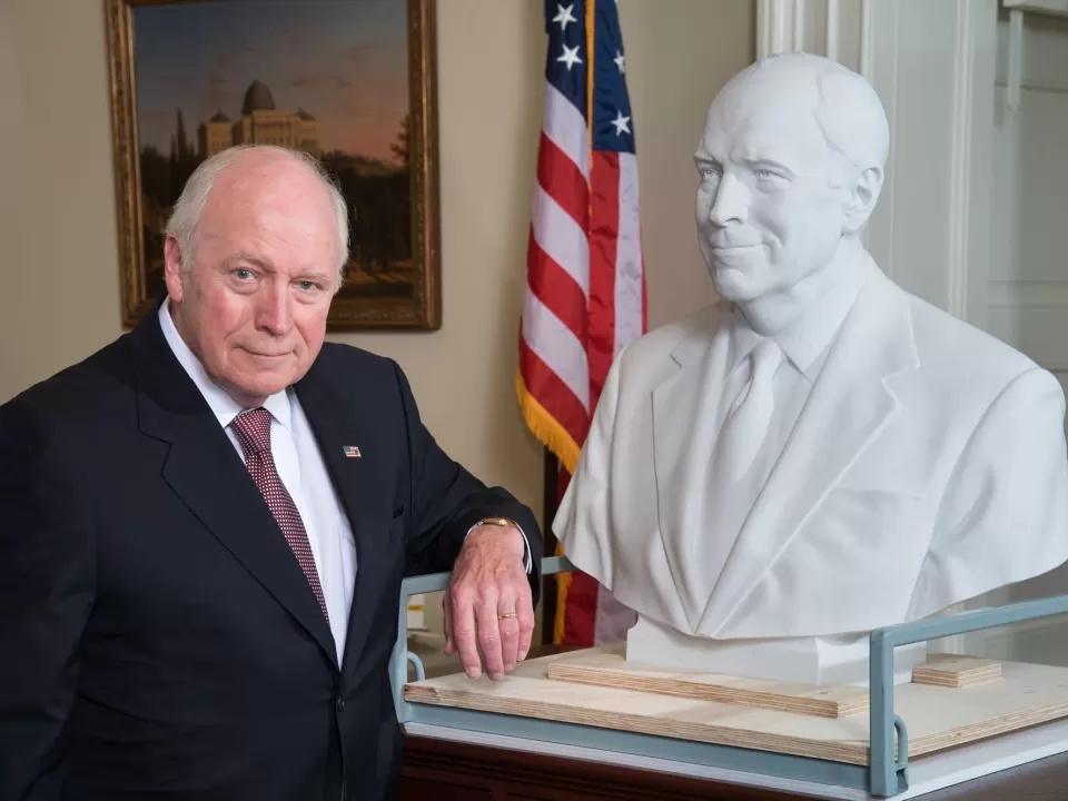 Vice President Cheney poses with the bust created in his likeness for the Senate collection in the U.S. Capitol.