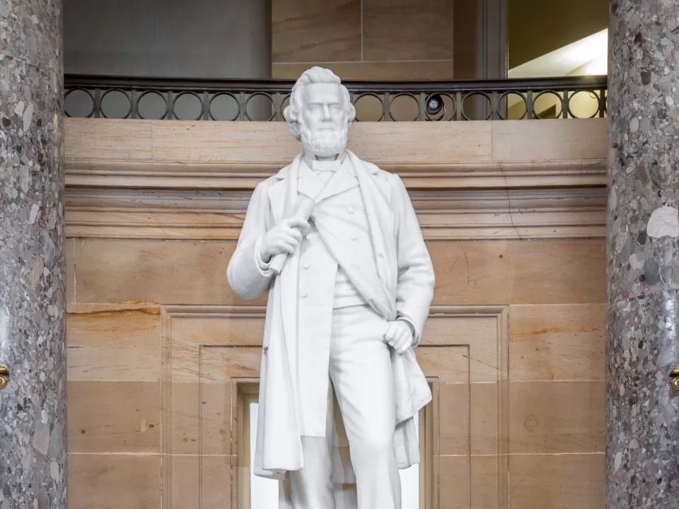 Marble statue of a person standing.