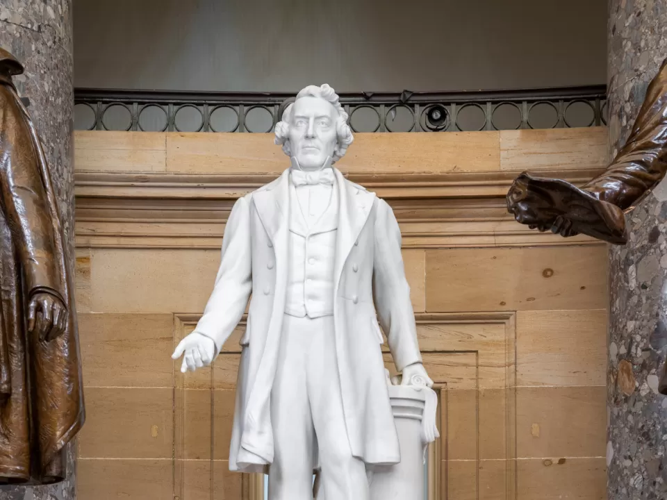 Marble statue of a person standing.