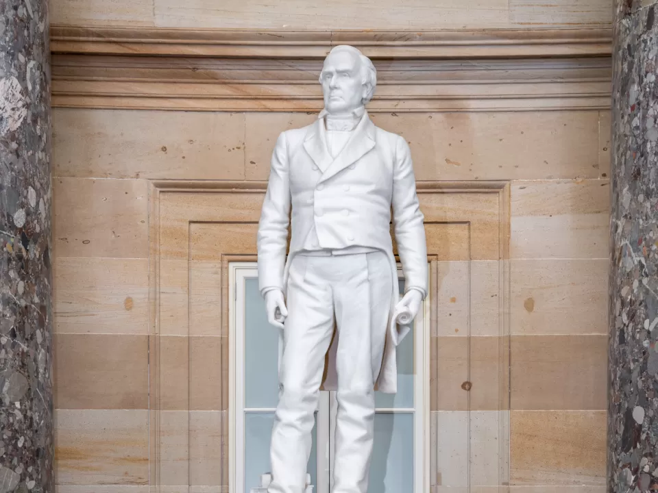 Marble statue of a person standing.