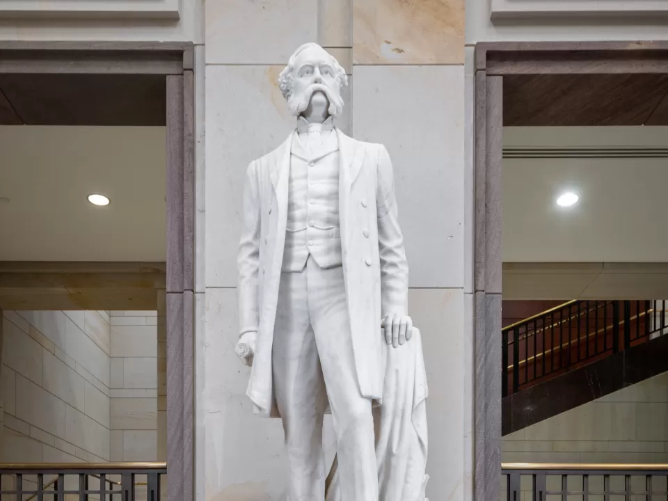 Marble statue of a person standing.