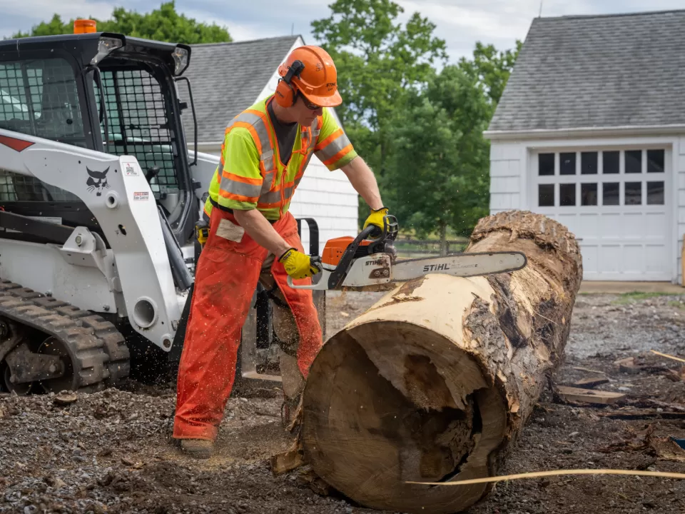 Person with a chainsaw.