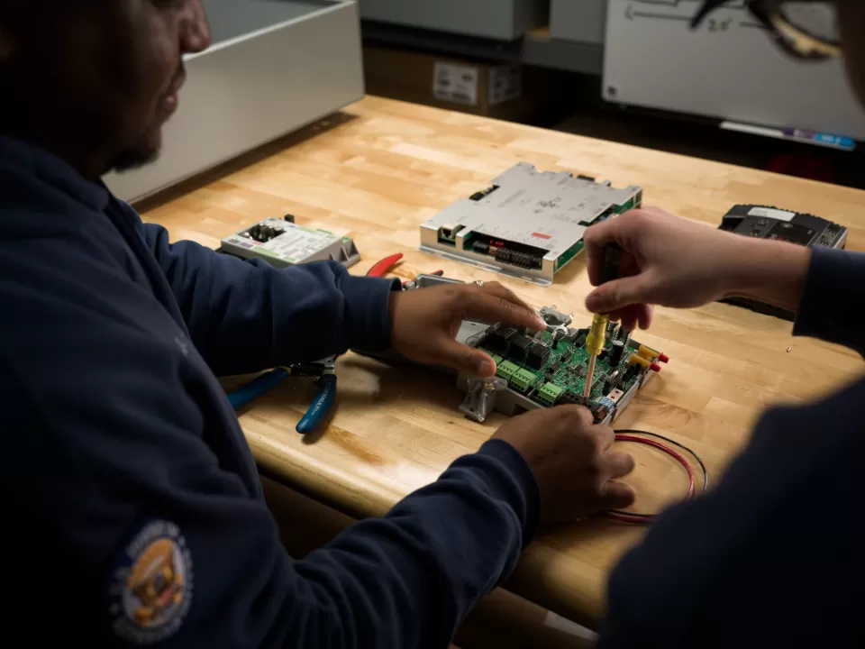Close-up of mechanics at work.