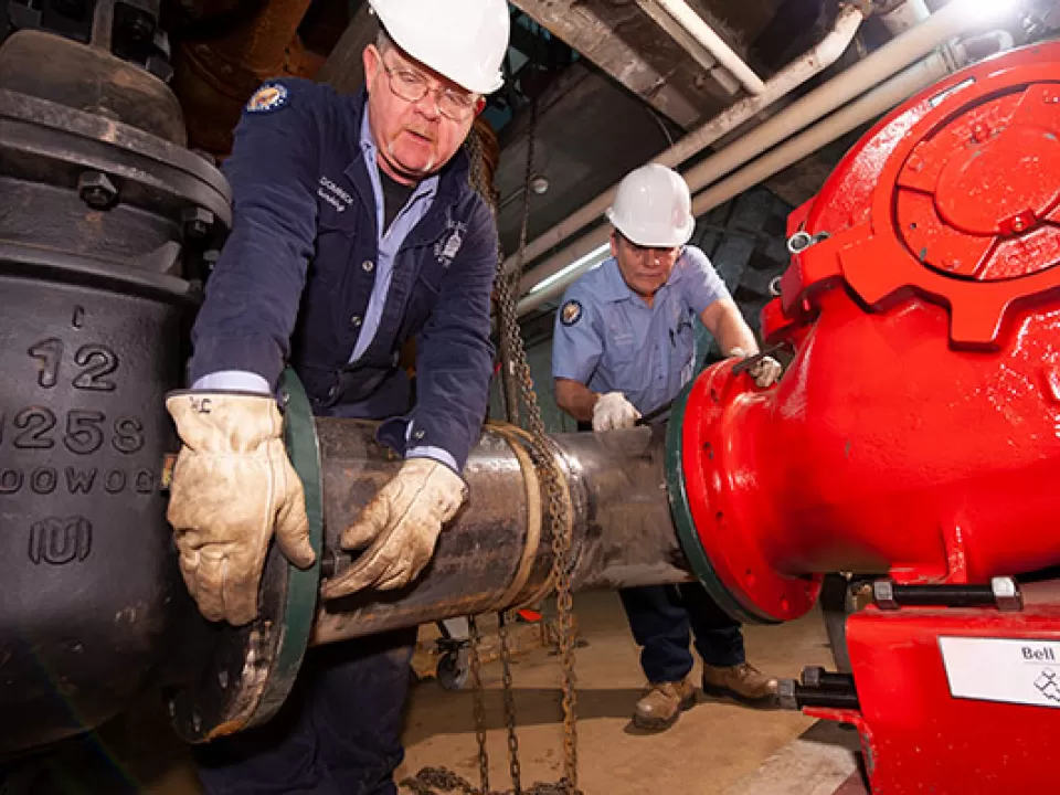 AOC Senate Office Buildings plumbing crew members.