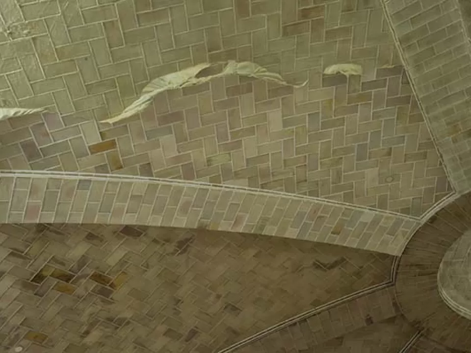 After workers sprayed a latex poultice on the tiles and let it dry, the poultice adhered to the accumulated dirt and dust. Once the latex was peeled back, it revealed the original color of the Guastavino tile.