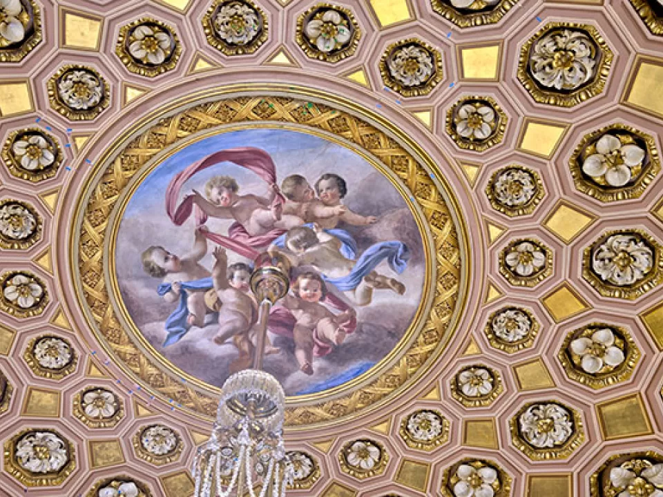 The ceiling nearest the entrance to S-213 from the corridor is a dome filled with elaborate rosettes set in gilded coffers.