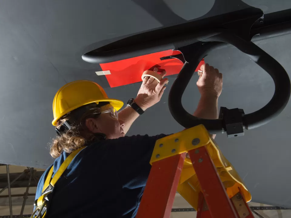 Person working on a ceiling.