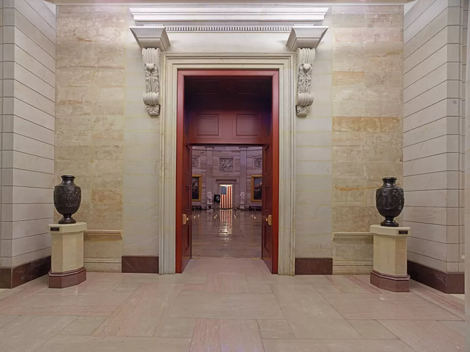 The bronze Federal Vases on display atop sandstone pedestals in the east front vestibule of the U.S. Capitol Rotunda.