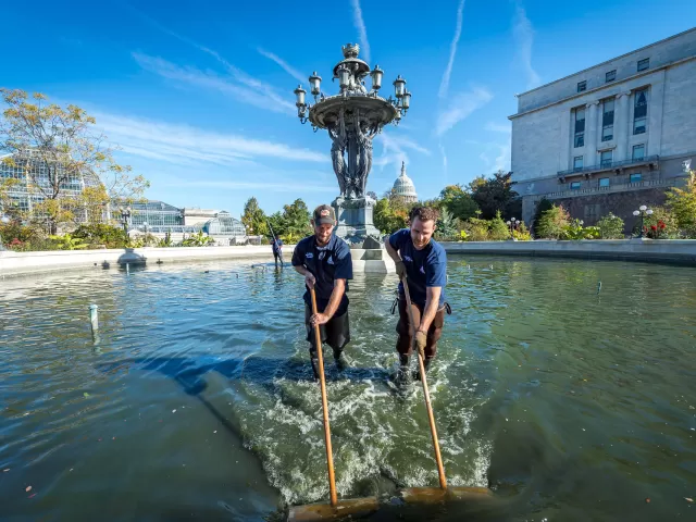 Workers cleaning Bartholdi Fountain