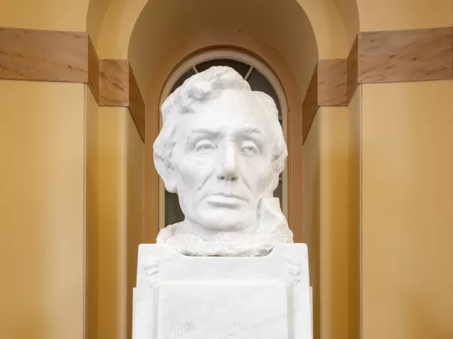 Marble bust on a pedestal.