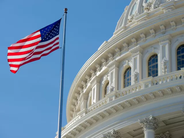 Flag of the United States of America near the U.S. Capitol Dome.