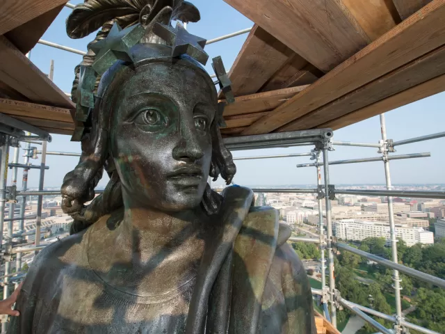 Up-close view of a statue's face.