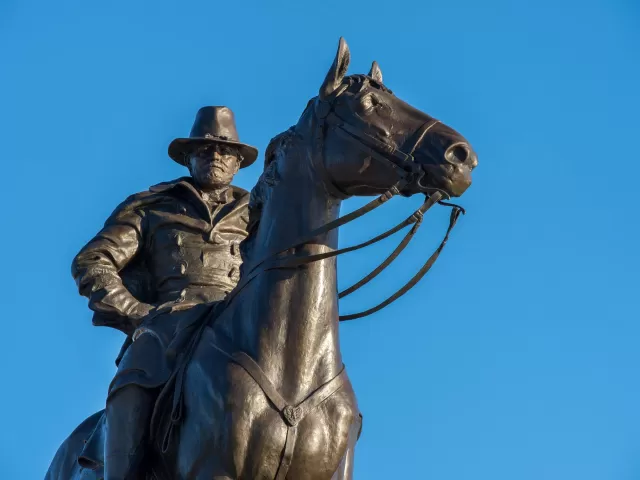 Bronze statue of a person on a horse.