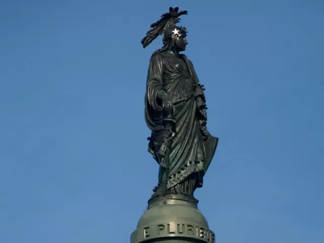 Statue of a person standing.