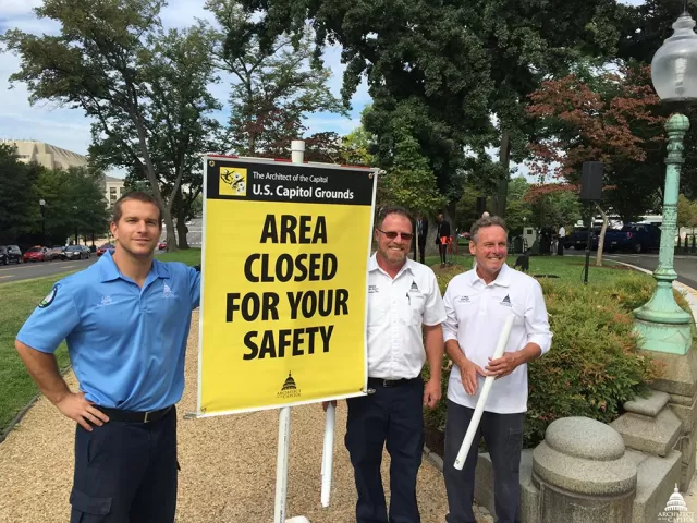 Group photo of members of the AOC Capitol Grounds team with the Safety Sign.