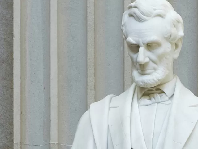Close-up detail of Abraham Lincoln's statue in the U.S. Capitol Rotunda.