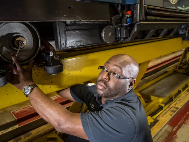 Person working on machinery.