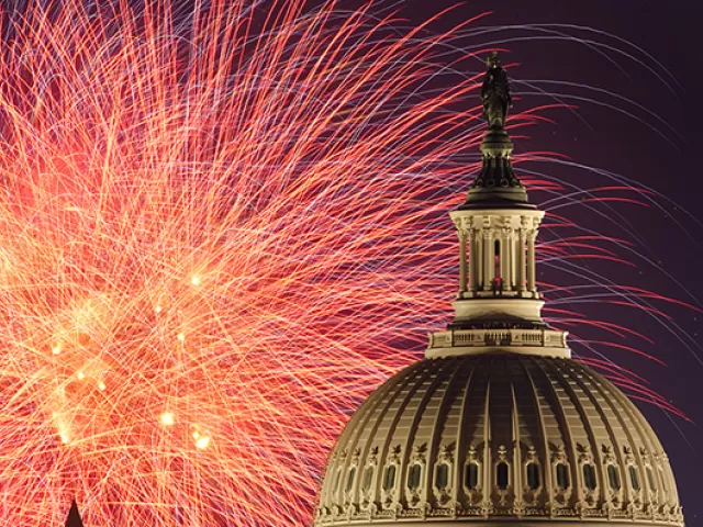 Fireworks bursting in the air with the U.S. Capitol dome on July 4th.