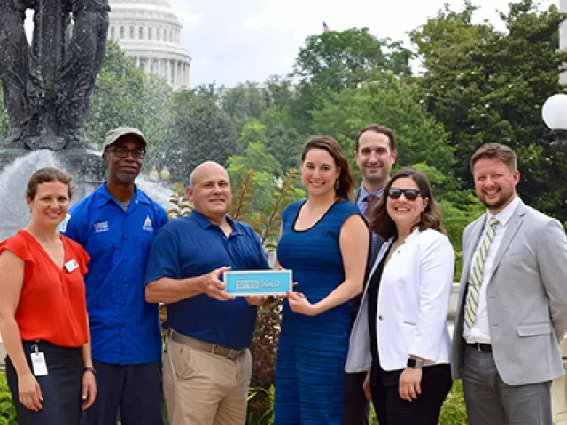 Members of the U.S. Botanic Garden and U.S. Green Building Council in Bartholdi Park with the SITES Gold Certification.