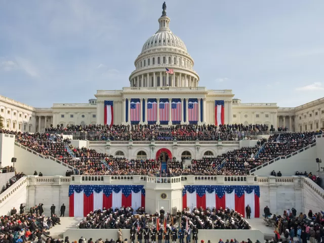 The U.S. Capitol with flags for a presidential inauguration.