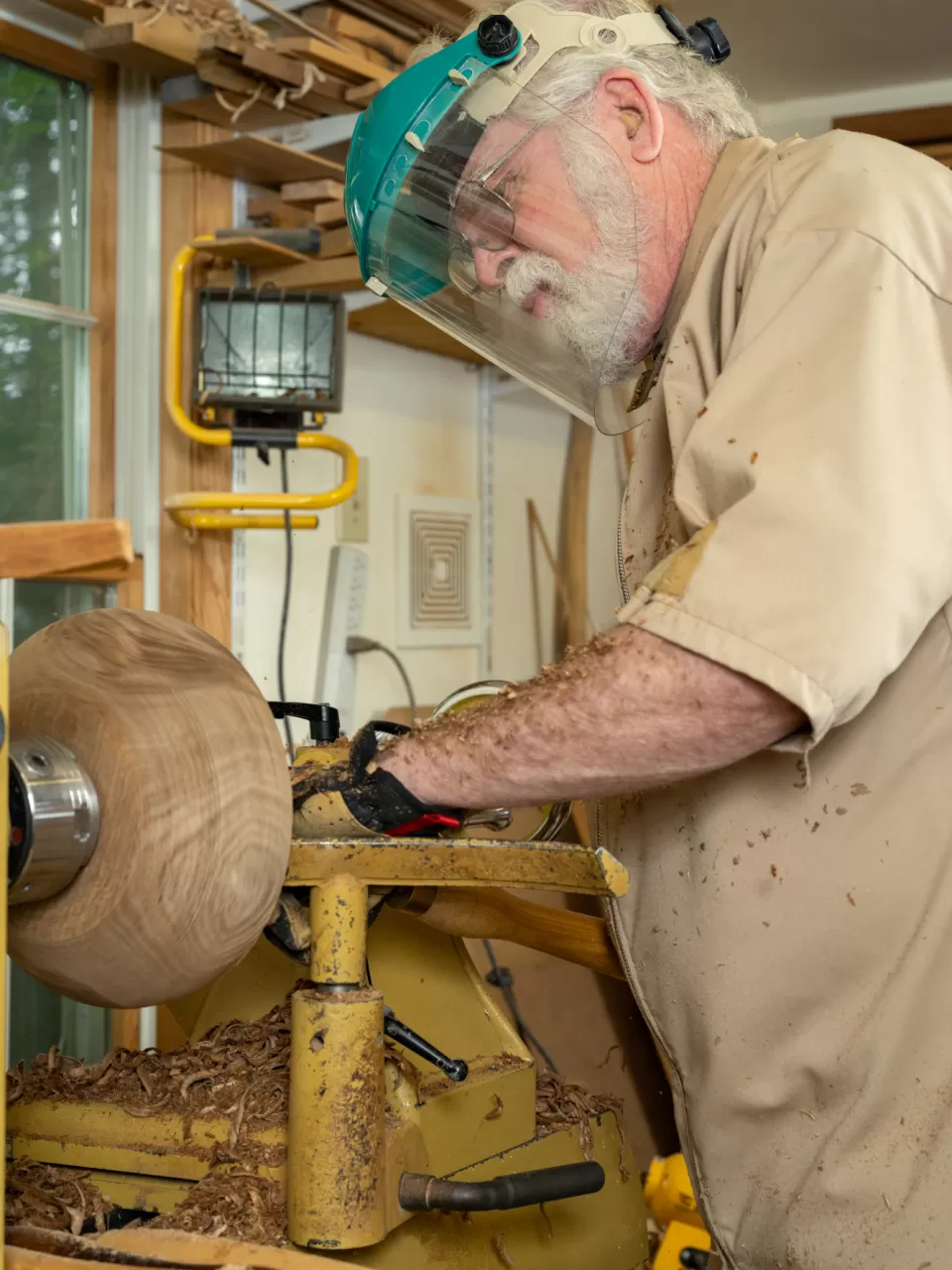 Person working with wood.