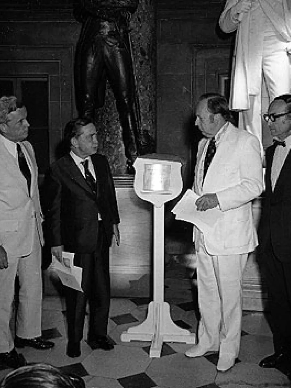 Unveiling and placement of the Lincoln desk marker in National Statuary Hall. Left to right: Representative Paul Findley, Speaker Carl Albert, Chairman Wayne L. Hays and 9th Architect of the Capitol George White.