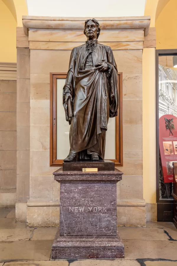 Bronze statue of a person standing.