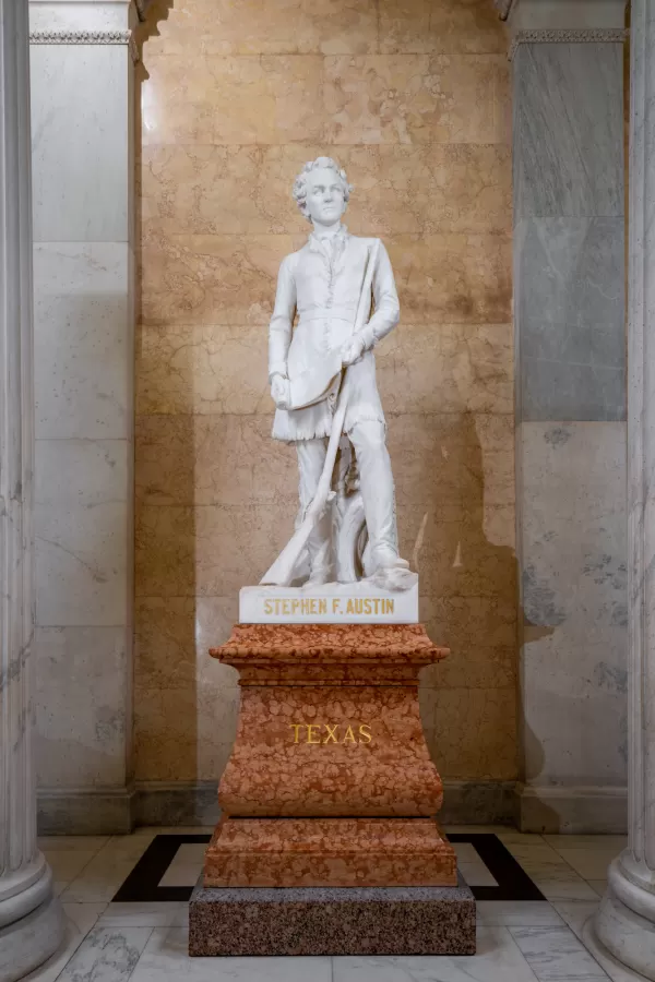 Marble statue of a person standing.