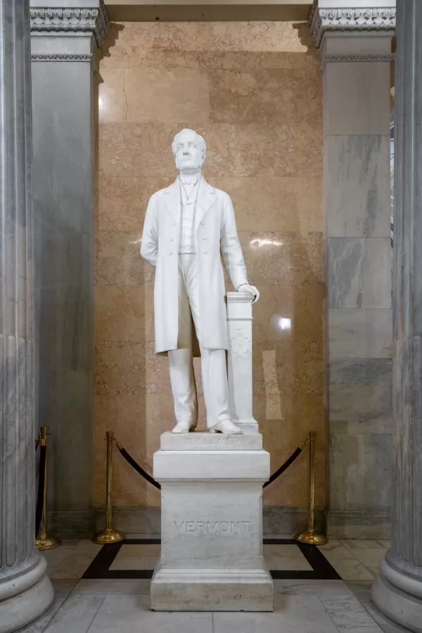 Marble statue of a person standing.