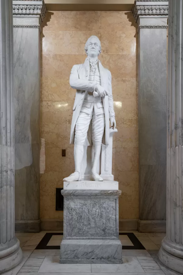 Marble statue of a person standing.