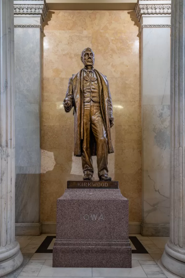 Bronze statue of a person standing.