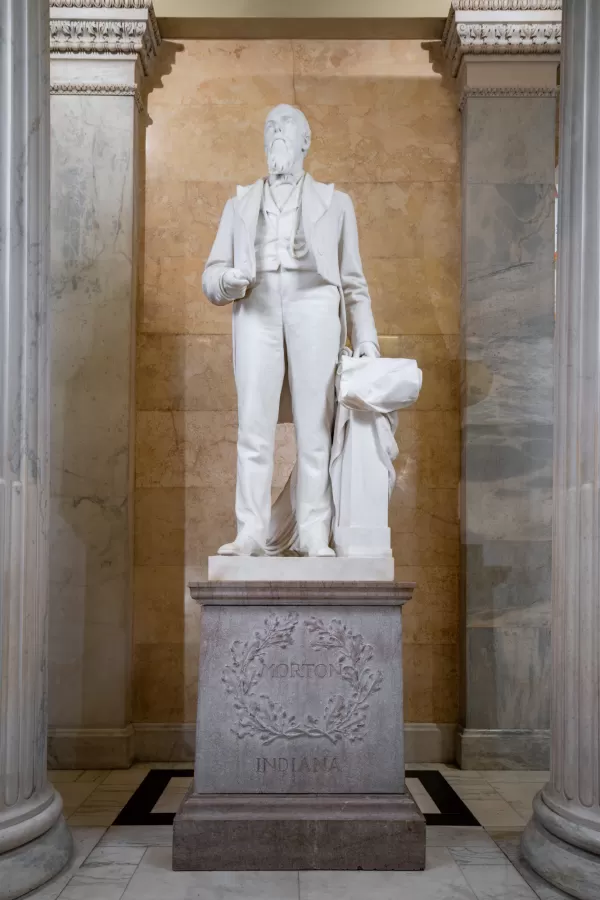 Marble statue of a person standing.