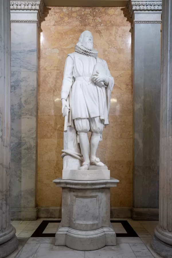 Marble statue of a person standing.